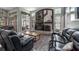 Bright living room with fireplace, built-ins, and stylish decor, open to the backyard at 7973 Lake Nellie Rd, Clermont, FL 34714