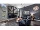 Comfortable living room with fireplace, built-ins, and stylish decor, open to the backyard at 7973 Lake Nellie Rd, Clermont, FL 34714