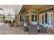 Spacious covered patio with ample seating, ideal for outdoor relaxation and entertaining at 7973 Lake Nellie Rd, Clermont, FL 34714