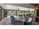 Inviting screened-in patio featuring a pool and comfortable lounge area at 7973 Lake Nellie Rd, Clermont, FL 34714