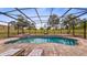Beautiful in-ground pool with lounge chairs, perfect for enjoying the outdoors at 7973 Lake Nellie Rd, Clermont, FL 34714