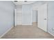 Open bedroom with closet space and wood-look tile flooring at 9027 Saint Andrews Way, Mount Dora, FL 32757