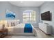 Bright bedroom with a large window and modern decor at 9027 Saint Andrews Way, Mount Dora, FL 32757