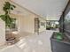 Spacious screened patio with plants and room for outdoor living and entertaining at 9027 Saint Andrews Way, Mount Dora, FL 32757