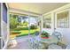 View from the screened patio to the landscaped backyard at 915 Sutherland Ct, Leesburg, FL 34788