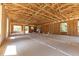 Open-concept home under construction featuring exposed framing, a concrete slab, and large window openings at Lot 43 Indian Estates Cr 423, Lake Panasoffkee, FL 33538
