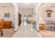 Bright foyer leading to living spaces, featuring tile flooring and an open, airy design at 10159 Se 174Th St, Summerfield, FL 34491