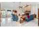 Inviting living room features tile flooring, and natural light, creating a cozy ambiance for relaxation at 10159 Se 174Th St, Summerfield, FL 34491