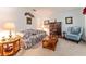 Cozy living room with comfortable seating, warm lighting, and tasteful decor for relaxation and entertaining at 10159 Se 174Th St, Summerfield, FL 34491