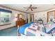 Bedroom featuring carpet, and a vanity dresser offering a cozy and stylish retreat at 10159 Se 174Th St, Summerfield, FL 34491