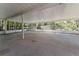 Covered patio with screened-in enclosure, perfect for enjoying the outdoors in comfort at 10159 Se 174Th St, Summerfield, FL 34491