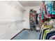 Spacious walk-in closet with ample shelving and storage for clothes and accessories at 10159 Se 174Th St, Summerfield, FL 34491