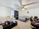Bedroom with a bed, ceiling fan, and large window at 10323 Joanies Run, Leesburg, FL 34788