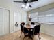 Sunny dining nook with tile flooring, a ceiling fan, and large window views at 10323 Joanies Run, Leesburg, FL 34788