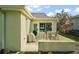 Charming backyard featuring a patio with outdoor seating, a grill, and lush landscaping for comfortable outdoor living at 1061 Woodruff St, The Villages, FL 32162