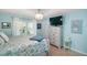 Cozy bedroom with a ceiling fan, plush bedding, and great natural light at 1061 Woodruff St, The Villages, FL 32162