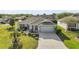 Charming single-story home with a well-maintained lawn and inviting curb appeal at 1061 Woodruff St, The Villages, FL 32162