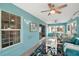 Bright sun room with lots of windows and a ceiling fan at 1061 Woodruff St, The Villages, FL 32162
