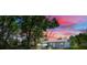 Well-maintained backyard featuring lush trees, providing a private and serene outdoor space at 1109 Hampton St, Clermont, FL 34711