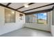 Enclosed Florida Room with jalousie windows, white block wall, wood ceiling, and outside access at 1109 Hampton St, Clermont, FL 34711