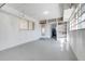 Spacious garage featuring concrete floors and windows at 1109 Hampton St, Clermont, FL 34711