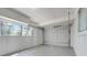 Garage interior featuring a large garage door and side windows at 1109 Hampton St, Clermont, FL 34711