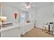 Bright bedroom with a cozy bed, desk, and ample natural light, creating a relaxing and functional space at 113 Camilla Rd, Deland, FL 32724
