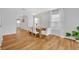Elegant dining area with a chandelier, natural light, and stylish wood floors for a cozy atmosphere at 113 Camilla Rd, Deland, FL 32724