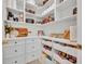 Organized pantry with ample shelving and storage drawers, ideal for keeping groceries and kitchen essentials tidy at 113 Camilla Rd, Deland, FL 32724