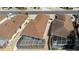 Aerial view showcasing the home's screened-in lanai and well-maintained roof, set in a quiet neighborhood at 1208 Santa Cruz Dr, The Villages, FL 32162
