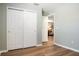 This bedroom is spacious, with wood floors and closet at 1208 Santa Cruz Dr, The Villages, FL 32162