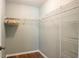 Walk-in closet with wire shelving and wood-look floors at 1208 Santa Cruz Dr, The Villages, FL 32162