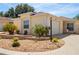 Charming single-story home boasts a well-manicured lawn and inviting curb appeal at 1208 Santa Cruz Dr, The Villages, FL 32162