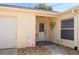 The front of the home shows the front door, walkway, and front window at 1208 Santa Cruz Dr, The Villages, FL 32162