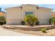 Close up of the home showcasing landscaping, retaining wall and driveway at 1208 Santa Cruz Dr, The Villages, FL 32162