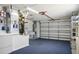 Garage with laundry, shelving and a garage door to the exterior of the home at 1208 Santa Cruz Dr, The Villages, FL 32162