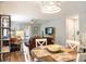 This living space has a dining table, living room, and open floor plan at 1208 Santa Cruz Dr, The Villages, FL 32162