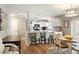 This living space has a dining table and kitchen at 1208 Santa Cruz Dr, The Villages, FL 32162