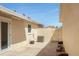 Enclosed patio area with AC, brick pavers, and a private wooden gate at 1208 Santa Cruz Dr, The Villages, FL 32162