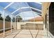 The screened-in lanai offers a relaxing outdoor space with clear roof panels and patio at 1208 Santa Cruz Dr, The Villages, FL 32162