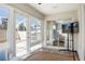 This sunroom features a screen door, tile floors and plenty of natural light at 1208 Santa Cruz Dr, The Villages, FL 32162