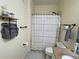 Full bathroom with shower/tub combo, granite vanity, and patterned shower curtain at 130 Southern Pecan # 105, Winter Garden, FL 34787