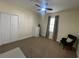 This bedroom offers a large window and closet at 130 Southern Pecan # 105, Winter Garden, FL 34787
