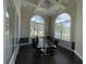 Well-lit conference room with a glass table, modern chairs, and large arched windows at 130 Southern Pecan # 105, Winter Garden, FL 34787