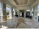 Impressive entrance with a star pattern, pillars, a patterned ceiling, and black benches at 130 Southern Pecan # 105, Winter Garden, FL 34787