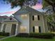 Charming two-story townhouse featuring a well-maintained lawn and inviting facade at 130 Southern Pecan # 105, Winter Garden, FL 34787
