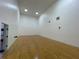 Well-lit indoor racquetball court featuring hardwood floors and a glass viewing area at 130 Southern Pecan # 105, Winter Garden, FL 34787
