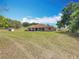 Expansive backyard provides plenty of space for recreation and relaxation, with a large grassy area at 13013 County Road 561A, Clermont, FL 34715