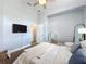 Cozy bedroom showcasing stylish decor, a ceiling fan, and a bright window at 13013 County Road 561A, Clermont, FL 34715