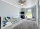 Bright bedroom with a window seat, large window, and neutral color palette at 13013 County Road 561A, Clermont, FL 34715